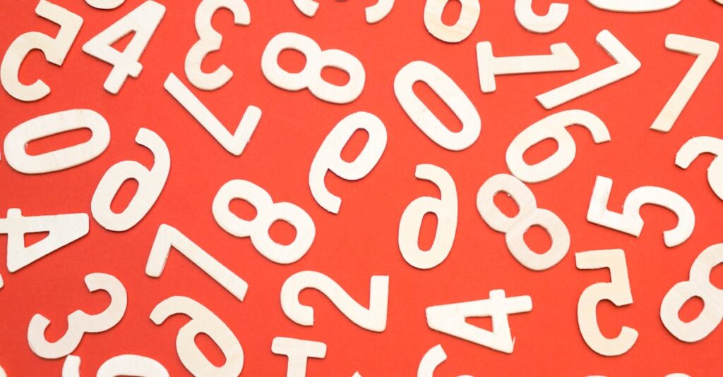 Artistic scattered white numbers on a bright red background, geometric and abstract.