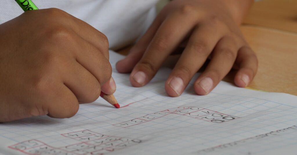 Close-up of a student writing math equations in a notebook with a pencil indoors.