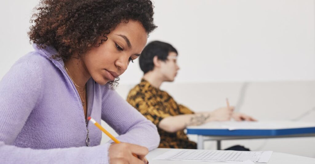 Young students concentrating on exams in a classroom, emphasizing focus and education.
